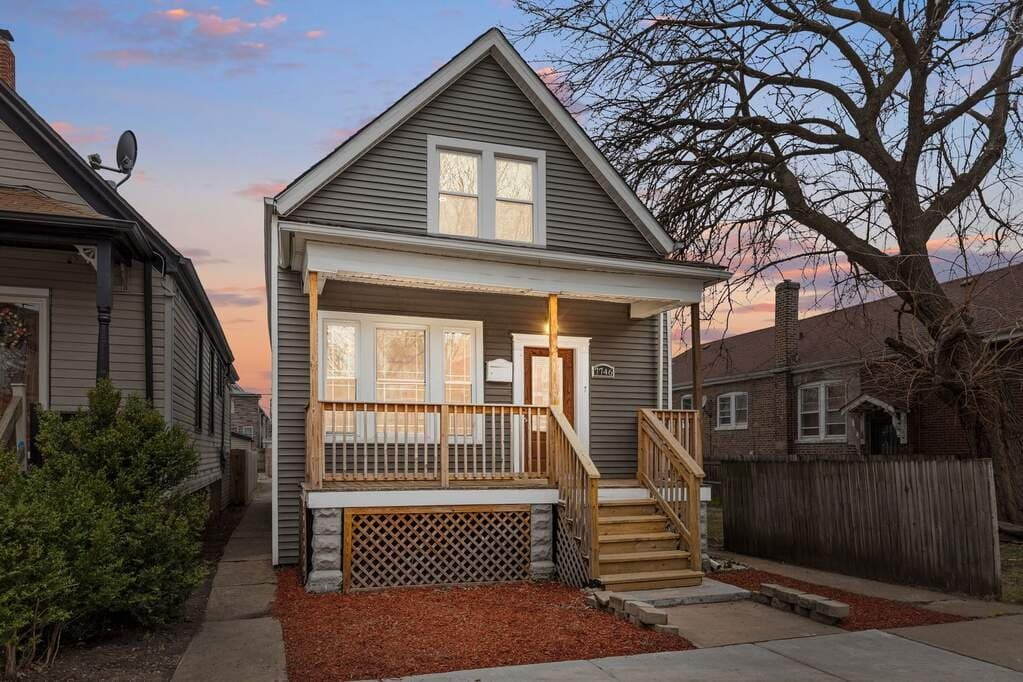 Renovated frame home with new porch at 7746 S Drexel Ave, Chicago